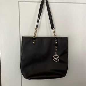 Michael Kors previously loved purse dark brown.